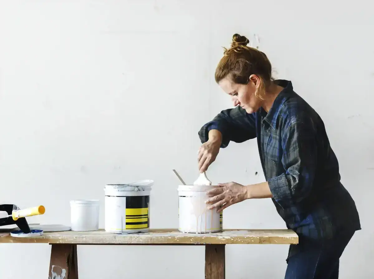 Woman preparing to paint a wall